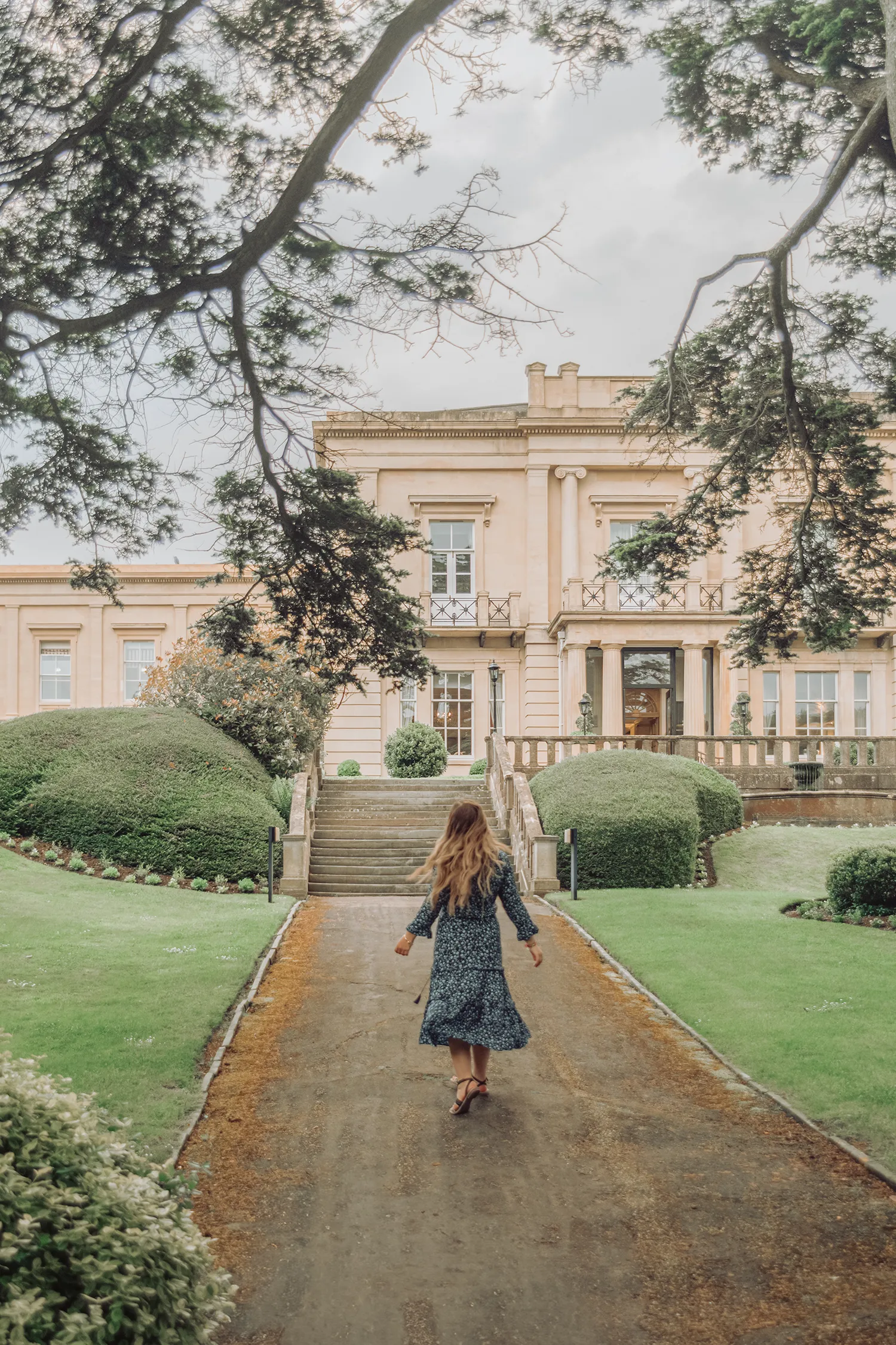Ida Eriksson walking toward Macdonald Bath Spa Hotel in Bath, England.